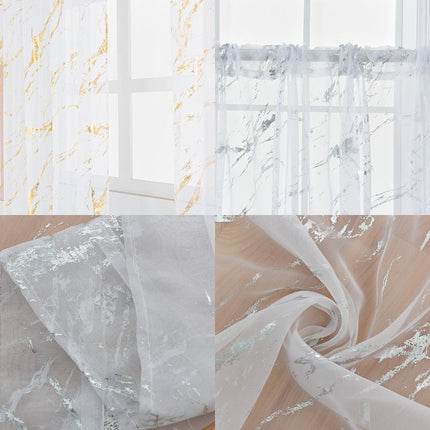 Gjennomsiktig voilegardin med gullmønster