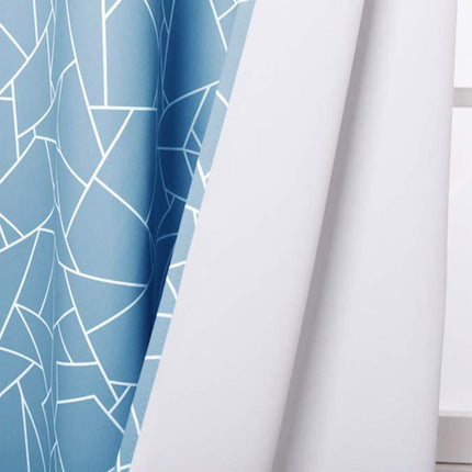 Mørkleggingsgardin med moderne grafisk mønster