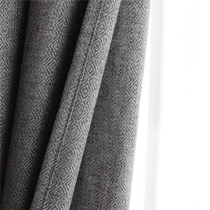 Lystett grå gardin med fin struktur