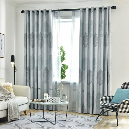 Lystett gardin med stort bladmotiv