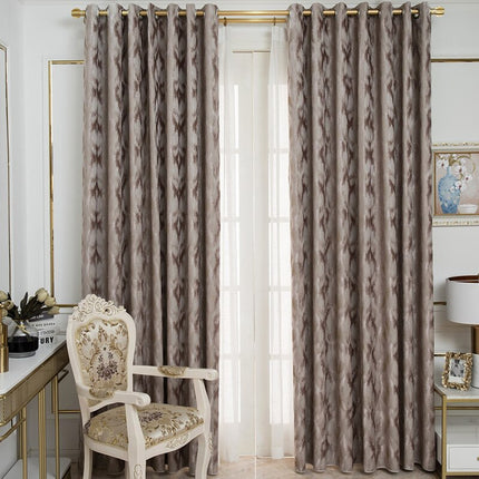 Gråbrun lystett gardin med mønster