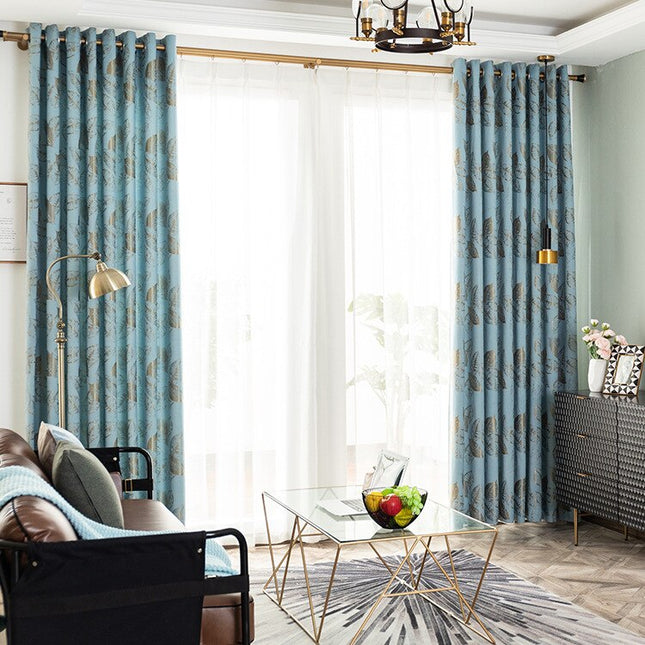 Moderne gardin med gyllent bladmønster