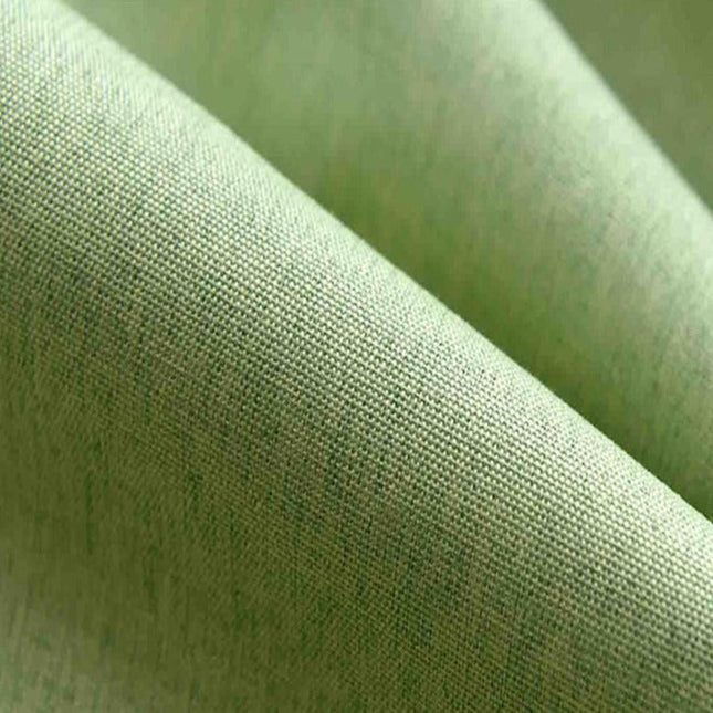 Grønn lystett gardin med struktur