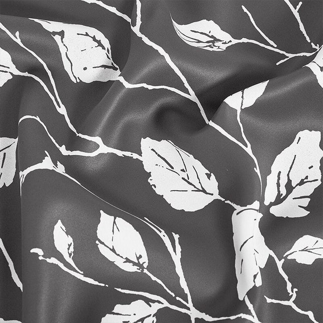 Mørk utendørs gardin med bladmønster