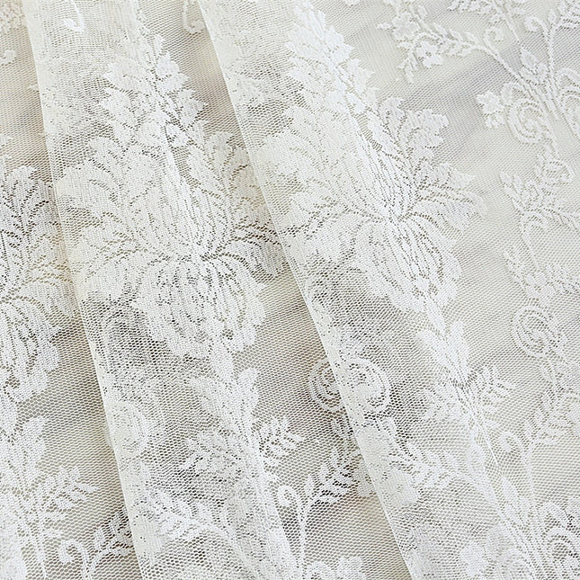 Gardin i blonde med blomstermotiv