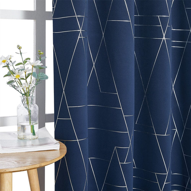 Blå lystett gardin med geometrisk mønster