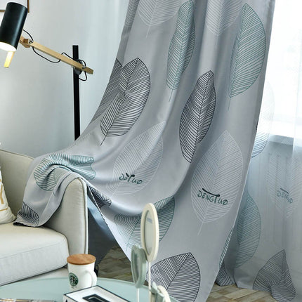 Lystett gardin med stort bladmotiv