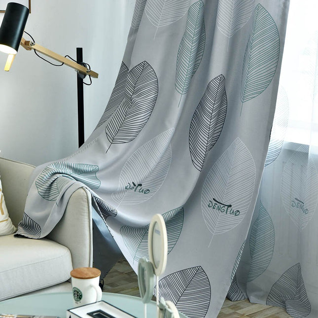 Lystett gardin med stort bladmotiv