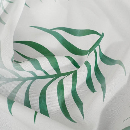 Hvit gardin med grønt palmebladmønster