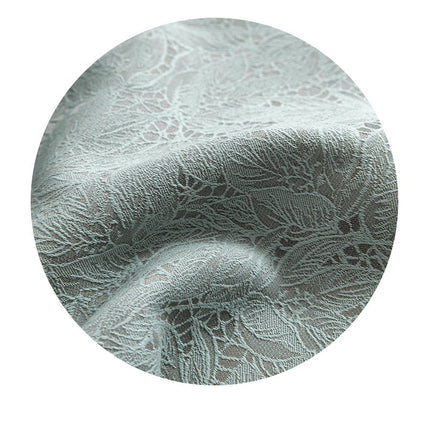 Pistasjgrønn mørkleggingsgardin med blondemotiv