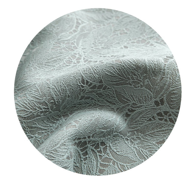 Pistasjgrønn mørkleggingsgardin med blondemotiv