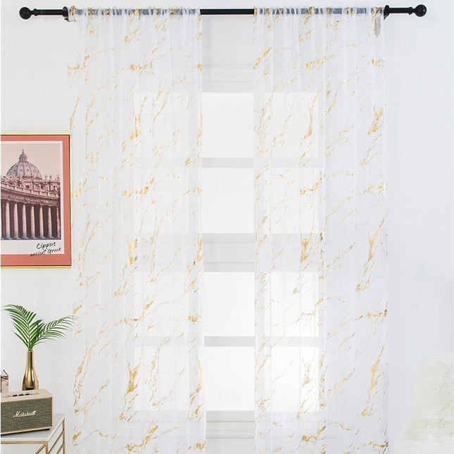 Gjennomsiktig voilegardin med gullmønster