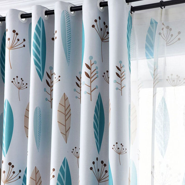 Blå lystett gardin med botanisk bladmønster