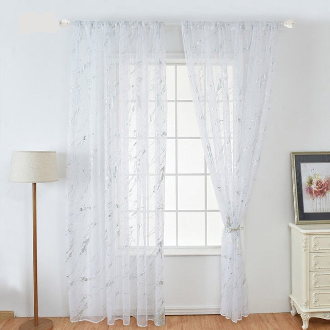 Gjennomsiktig voilegardin med gullmønster