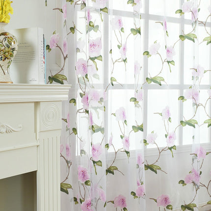 Transparent gardin med vakkert blomstermotiv