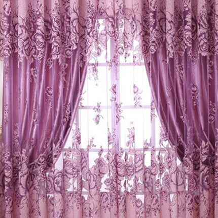 Lett gardin med stort blomstermotiv