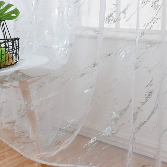 Gjennomsiktig voilegardin med gullmønster