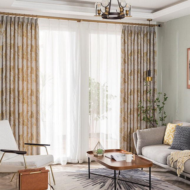 Moderne gardin med gyllent bladmønster