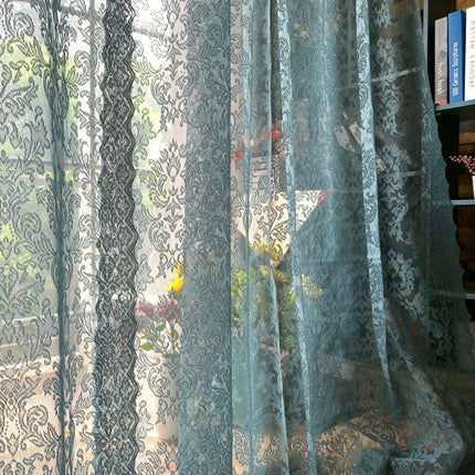 Blå blondegardin med damaskmønster