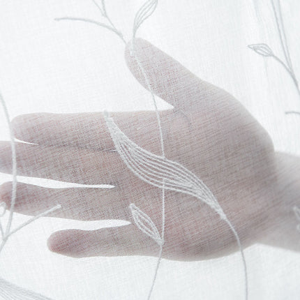 Lett gardin med botanisk mønster