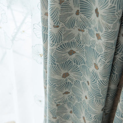 Mønstret mørkleggingsgardin med delikat blomstermotiv