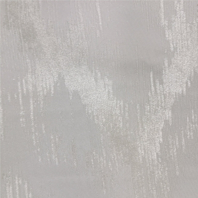 Gråbrun lystett gardin med mønster