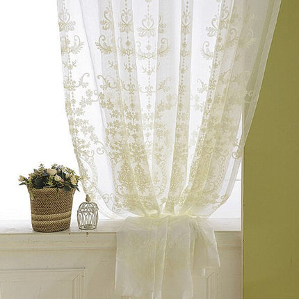 Gjennomsiktig gardin med elegant broderi