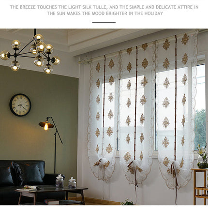 Brodert heisgardin i transparent stoff