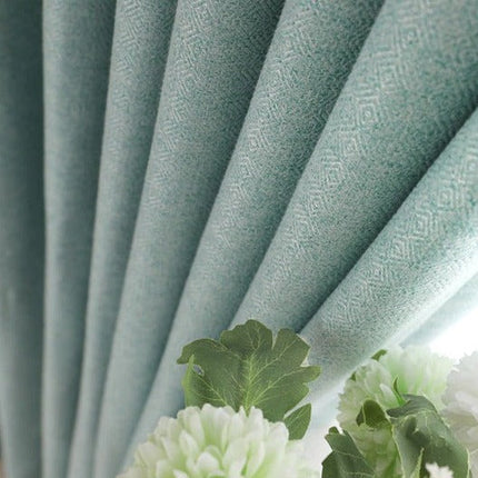 Halv-lystett gardin i en turkis farge