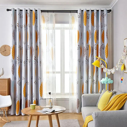 Lett gardin med gult bladmønster