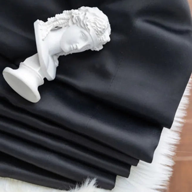 Heldekkende svart lystett gardin Tisto