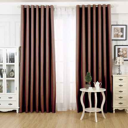 Kaffebrun mørkleggingsgardin med maljer