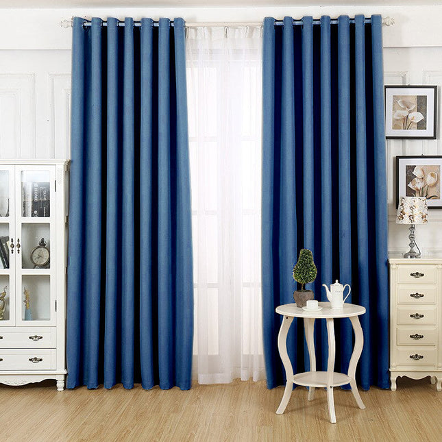 Moderne blå stuegardin med maljer