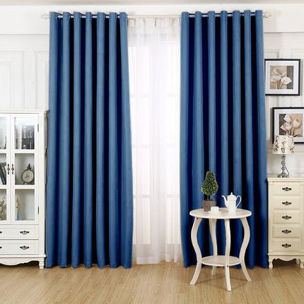 Moderne blå stuegardin med maljer