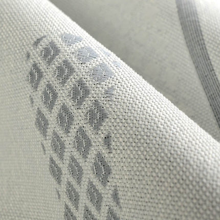 Grå lystett gardin med geometrisk mønster